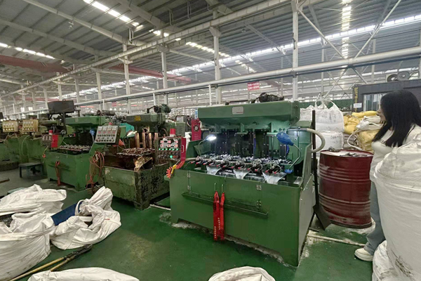 Workers manufacturing factory direct fasteners for construction buyers to reduce costs and eliminate middlemen